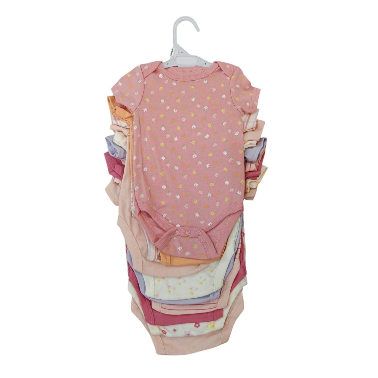 Set de bodies para bebé Acüchichi en tonos pastel y estampados florales de algodón suave con cierres a presión.