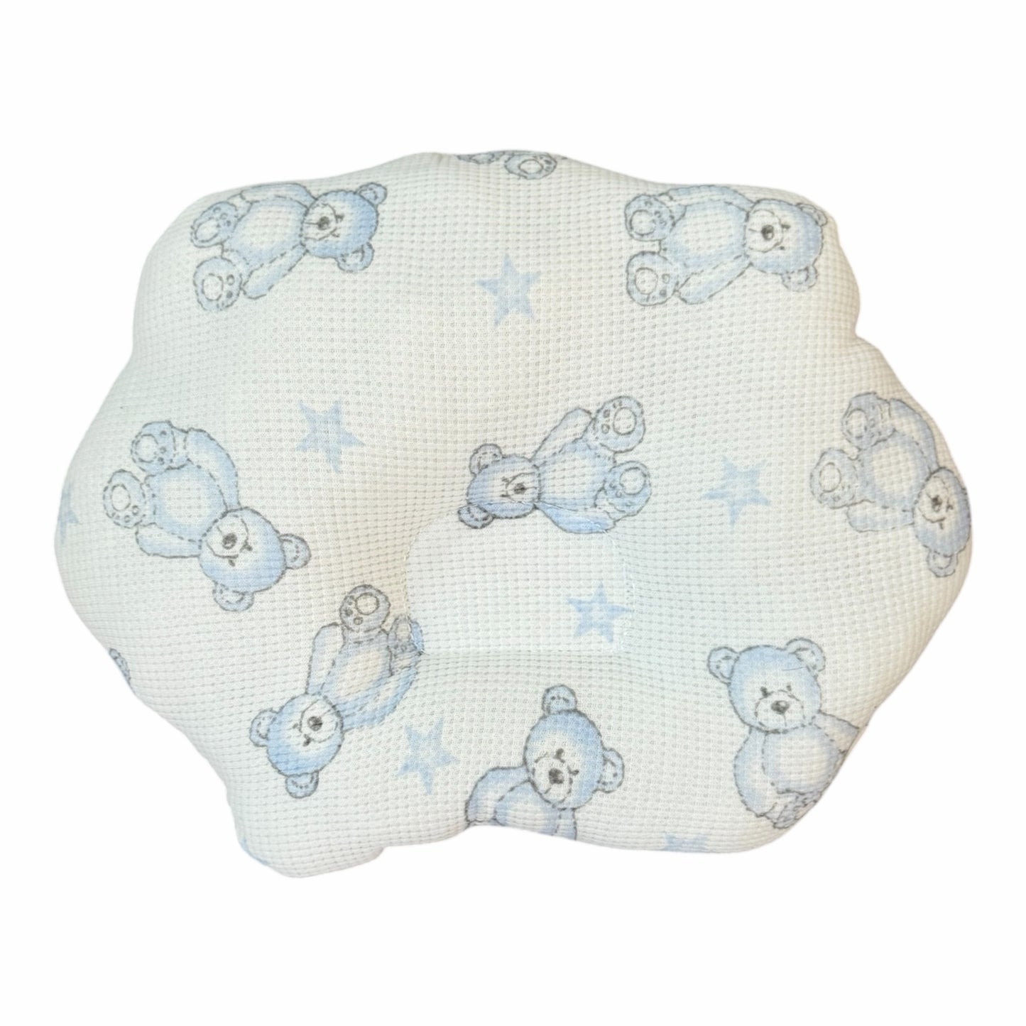 Almohada anatómica Acüchichi para bebé con estampado de ositos azules y estrellas sobre tejido blanco tipo nido de abeja
