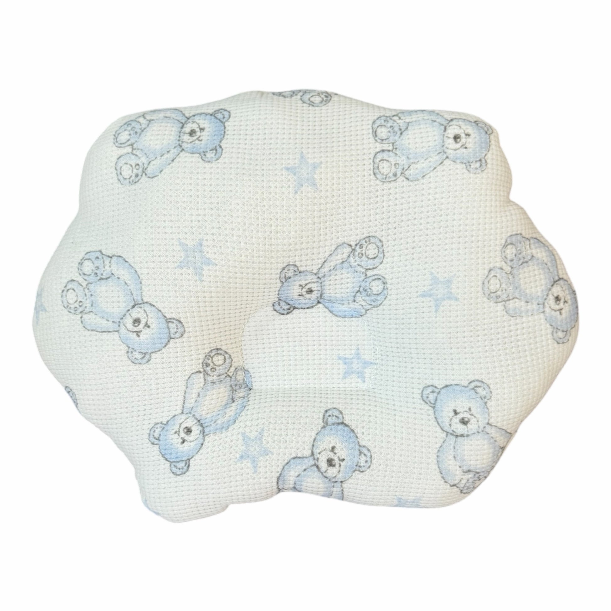 Almohada anatómica Acüchichi para bebé con estampado de ositos azules y estrellas sobre tejido blanco tipo nido de abeja