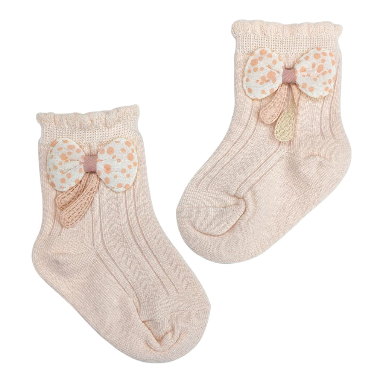 Calcetines Acüchichi para bebé en color rosa suave con tejido acanalado y lazo decorativo de lunares
