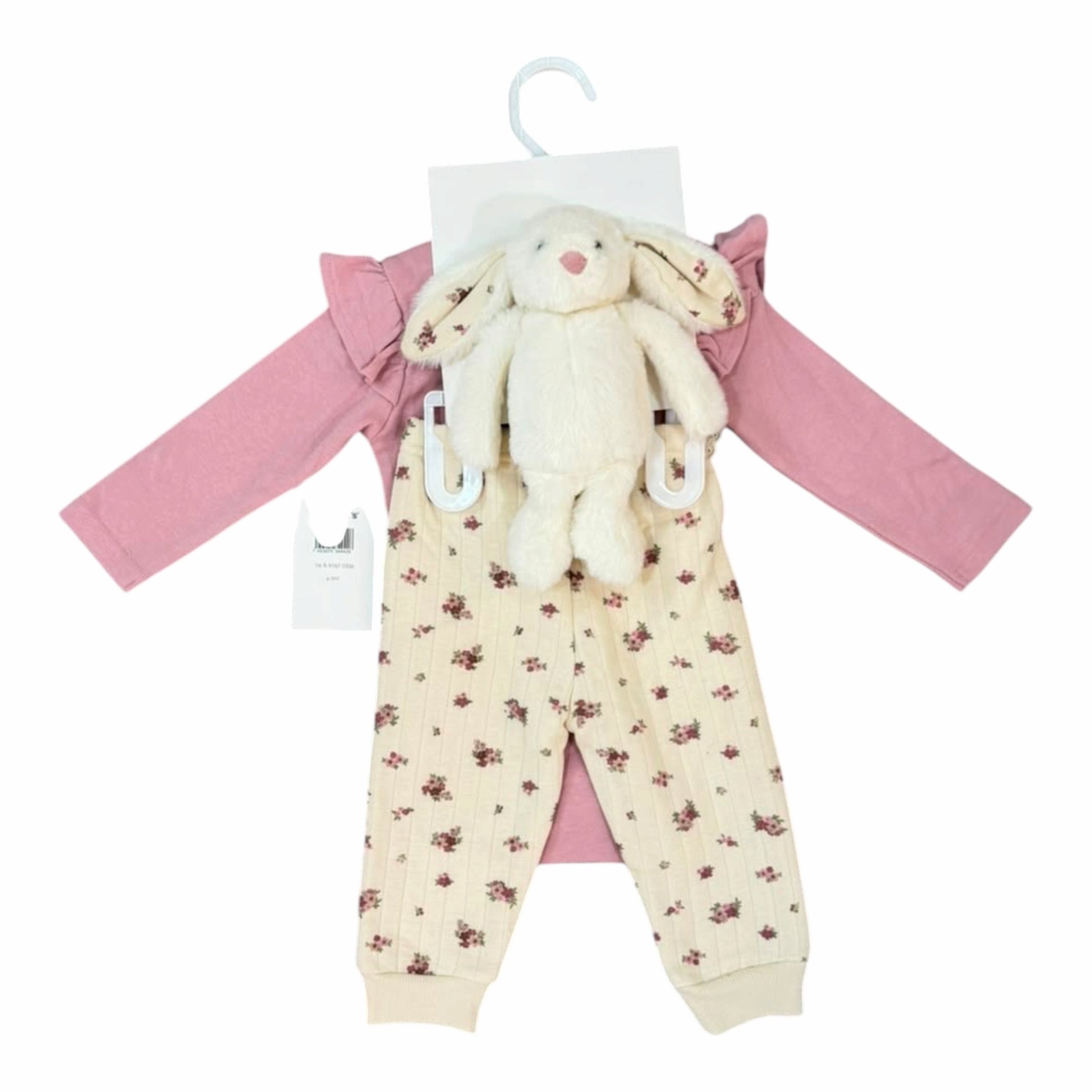 Conjunto Acüchichi de bebé con body rosa de volantes, pantalón acanalado floral crema y peluche de conejito incluido.