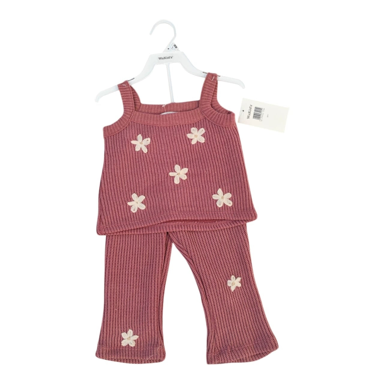 Conjunto Acüchichi de dos piezas para niña en tejido acanalado rosa con flores aplicadas en relieve
