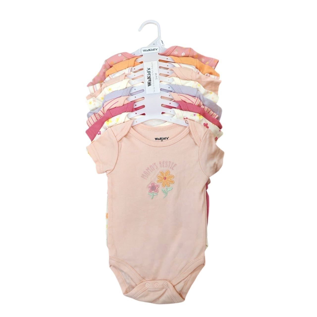 Set de bodies para bebé Acüchichi en tonos pastel y estampados florales, confeccionados en algodón suave.