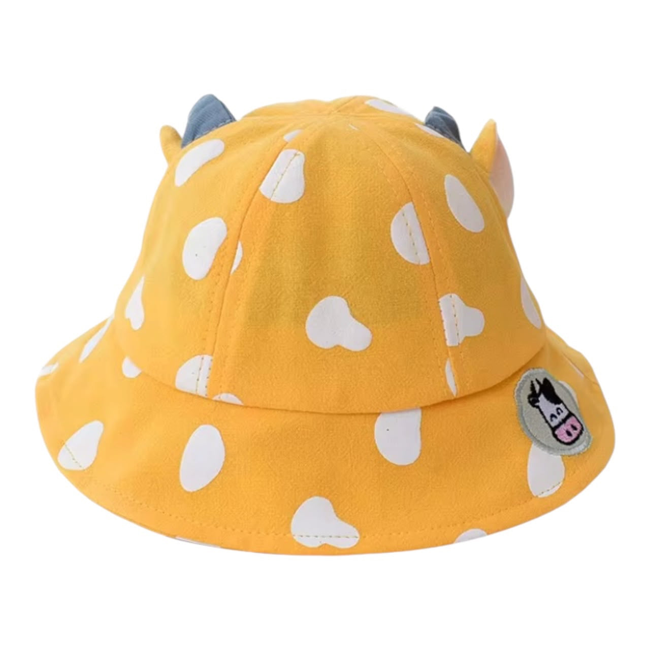 Sombrero tipo pescador Acüchichi amarillo con estampado de manchas blancas, cuernos decorativos y parche de vaquita.